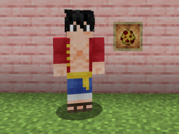 Picture of Luffy from One Piece portrayed as a blocky Minecraft person. Luffy is standing Infront of a wall of Cherry Wood Planks. On the wall of planks is a Glow Item Frame holding a Spawn Egg that is yellow with red spots.