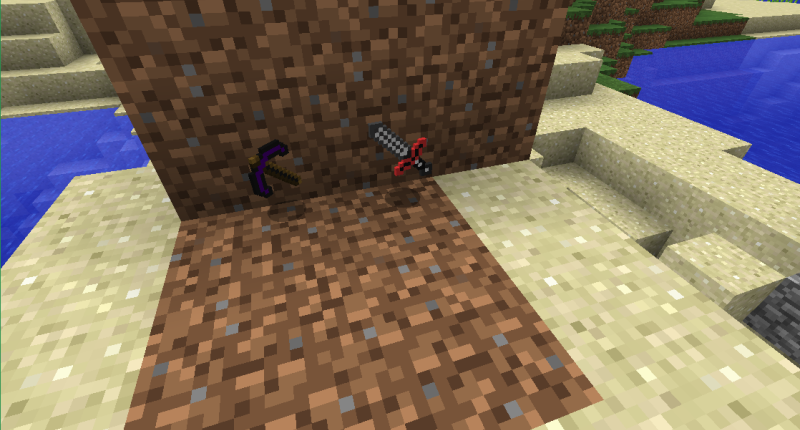 Obsidian Pickaxe and a sword on the ground