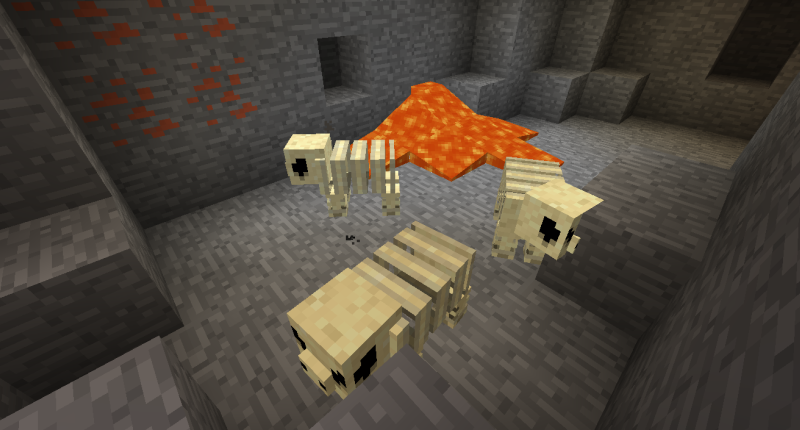 Fossil Monsters walk around near a pool of lava and some copper ore.