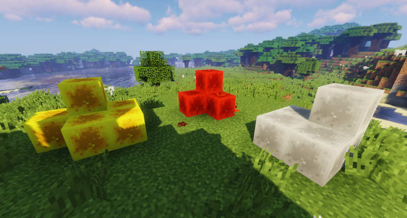 the Block of Sulfur (left) and the Block of Saltpeter (right) shown next to a pile of Redstone blocks.